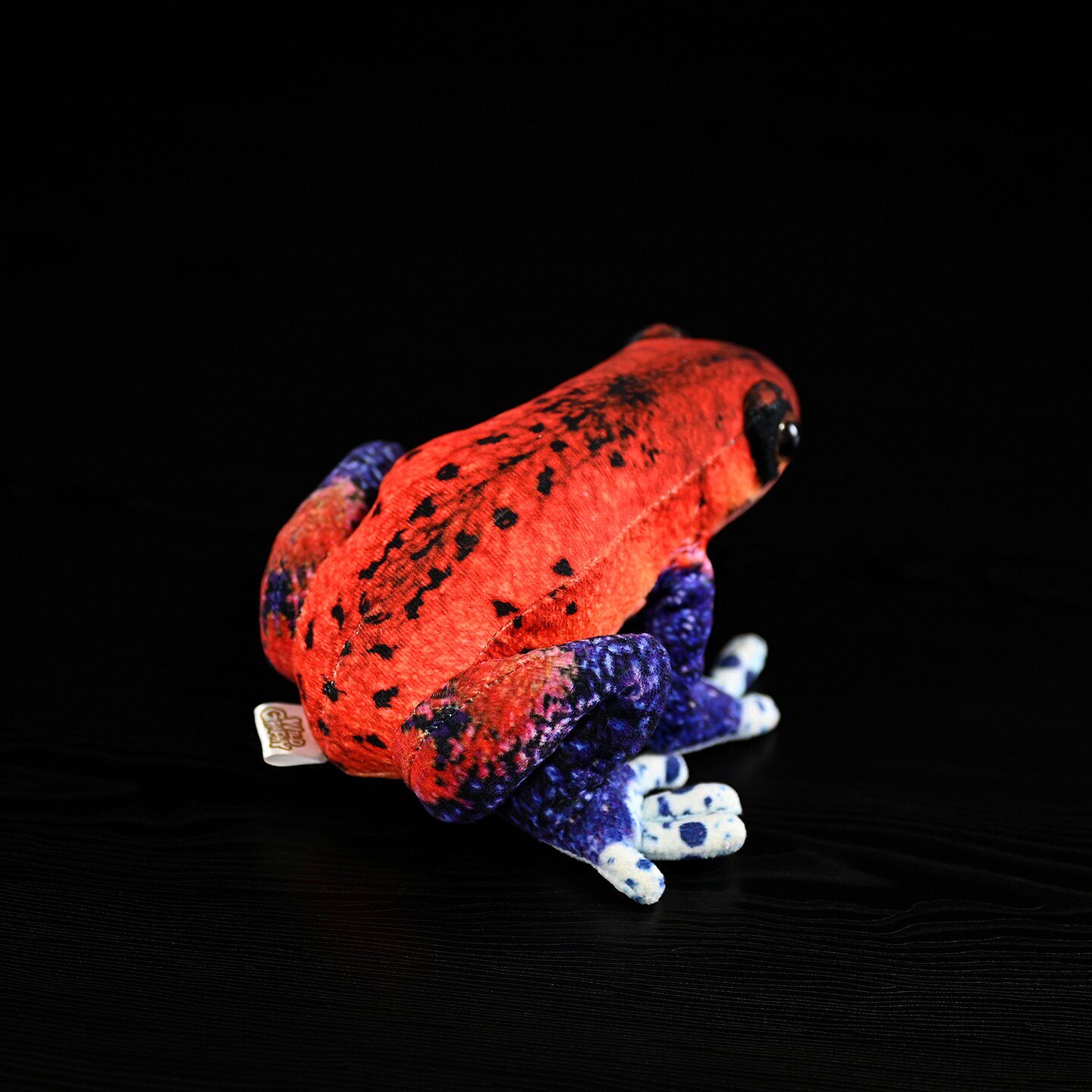 Back view of Strawberry Poison Dart Frog Plush showcasing vibrant red and blue hues by SoftDaysLab
