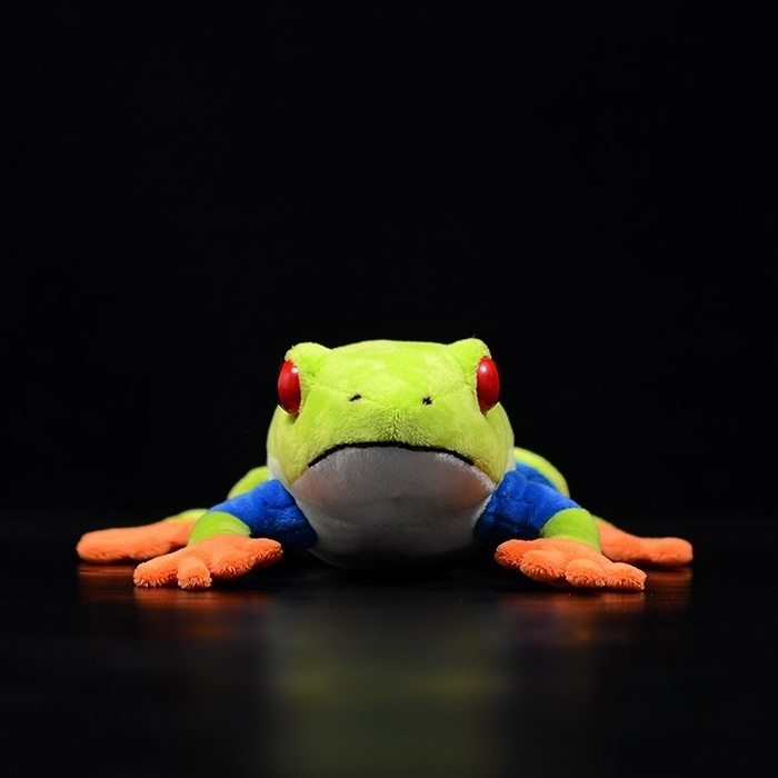 Front view of lifelike Red-Eyed Tree Frog plush toy with bright red eyes and colorful limbs
