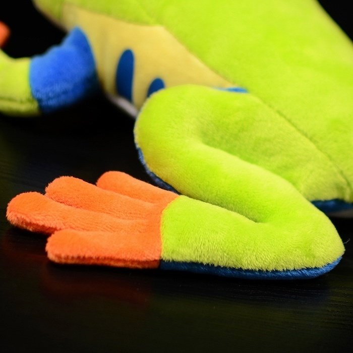 Rear detail of the Red-Eyed Tree Frog plush’s vibrant orange foot and curled green leg