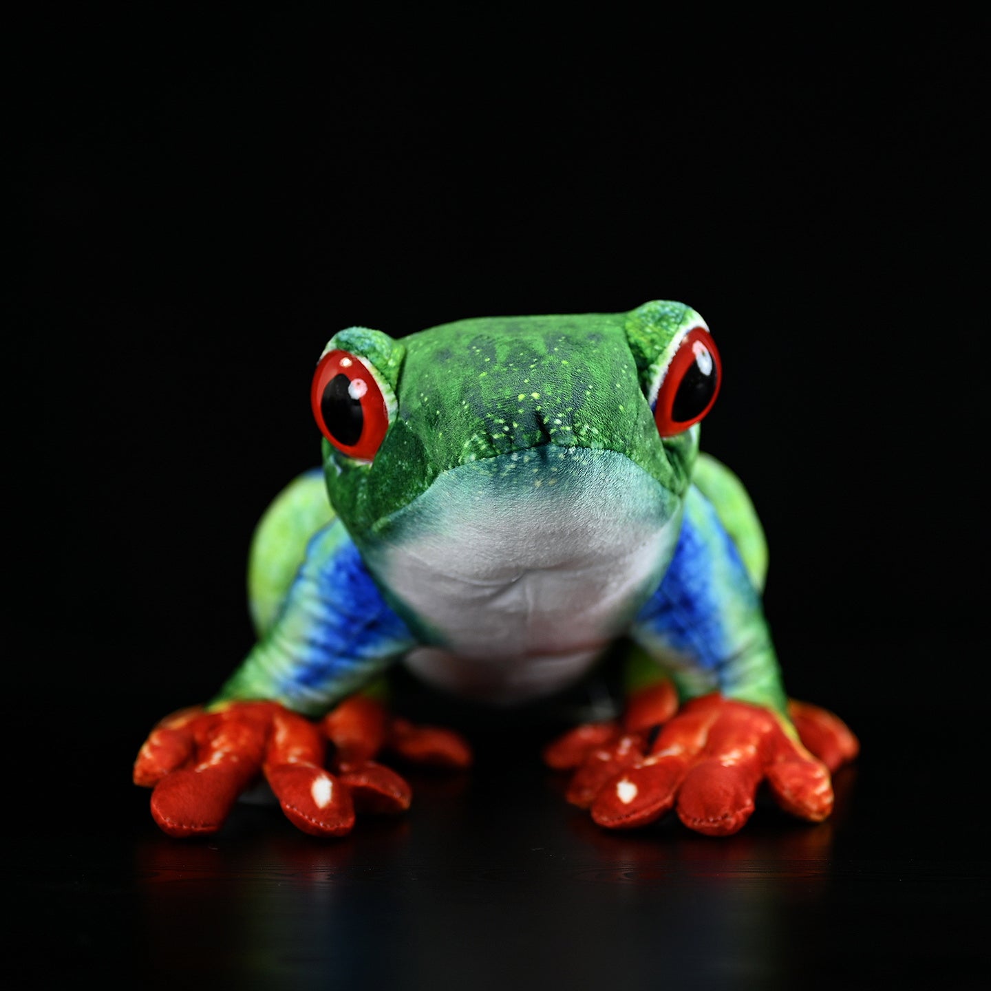 Front view of an ultra-realistic red-eyed tree frog plush with vivid red eyes and green body by SoftDaysLab
