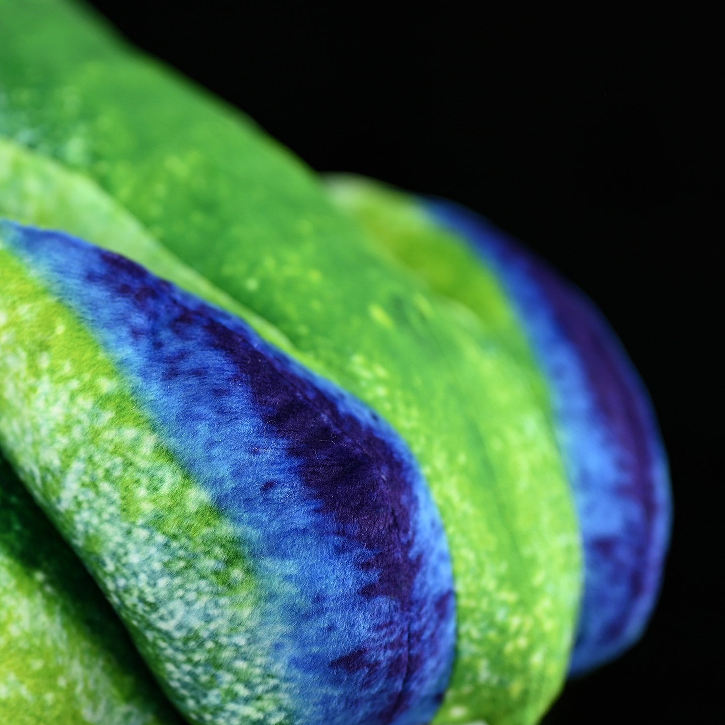 Detailed back texture of a SoftDaysLab red-eyed tree frog plush with lifelike green and blue color patterns