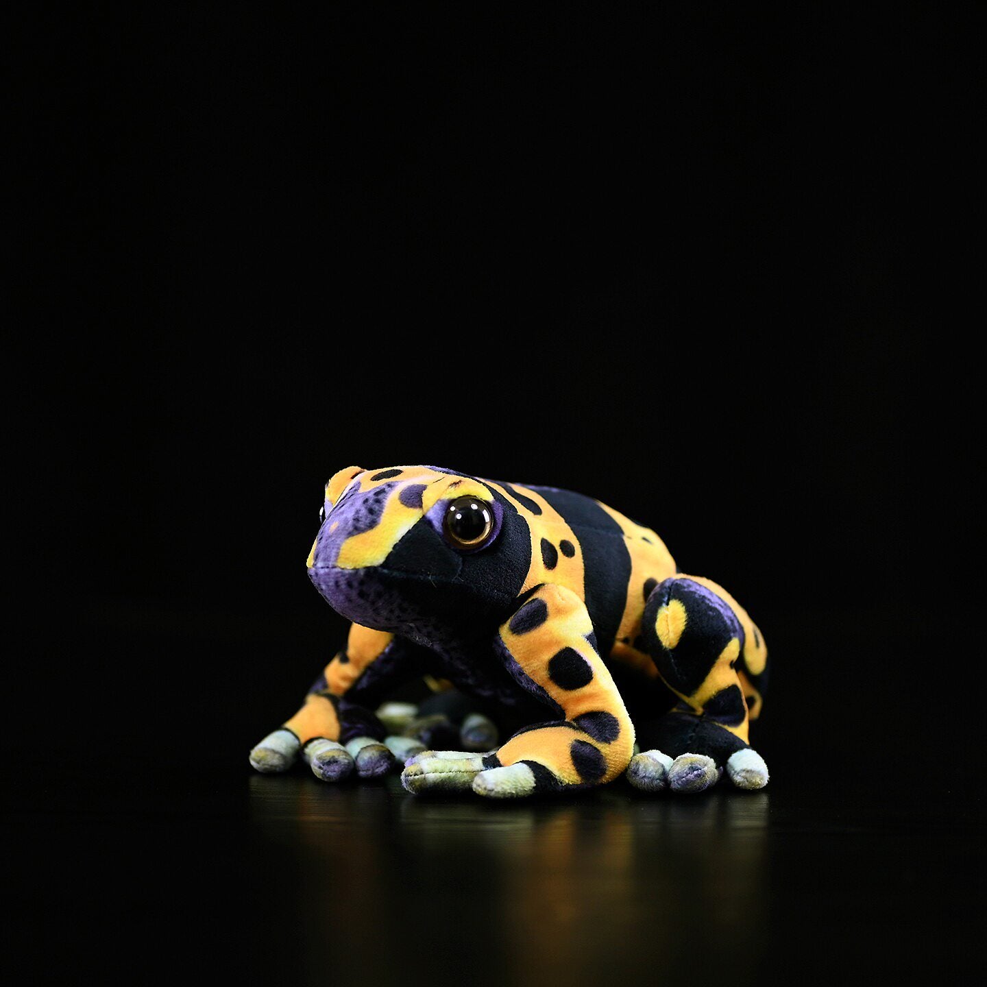 Side view of Yellow-Banded Poison Dart Frog Plush showcasing lifelike patterns and bright yellow details