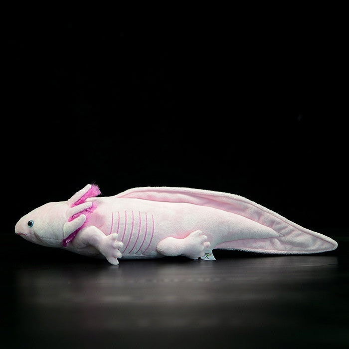 Side view of pink axolotl plush toy by SoftDaysLab, showcasing lifelike design and delicate details