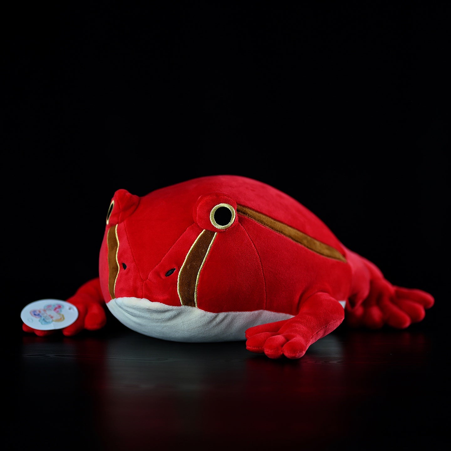 Front angle of Madagascar Tomato Frog plush toy, featuring vibrant red-orange tones and lifelike design