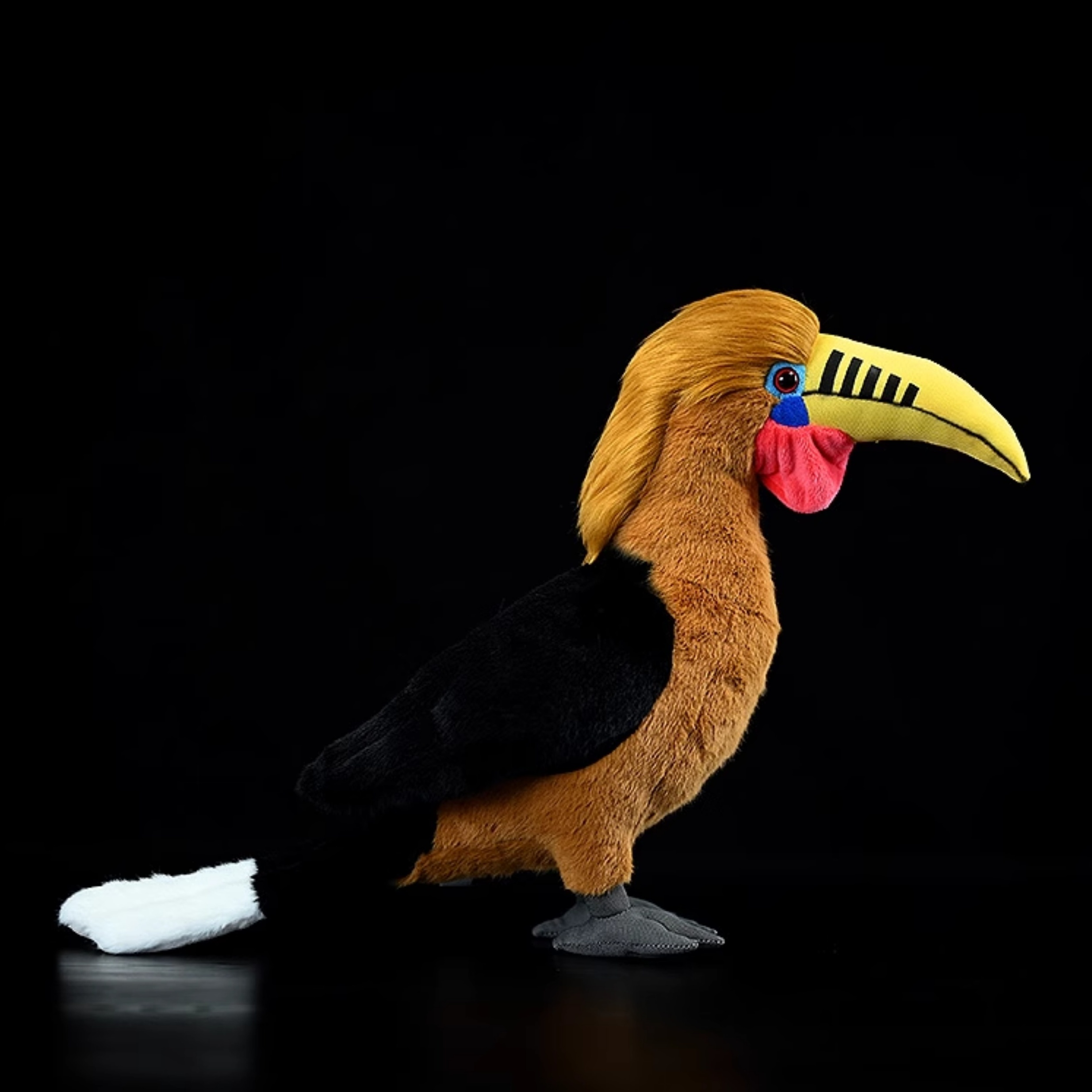 Side view of a Rufous-necked Hornbill plush toy with lifelike rufous neck and elegant black wings