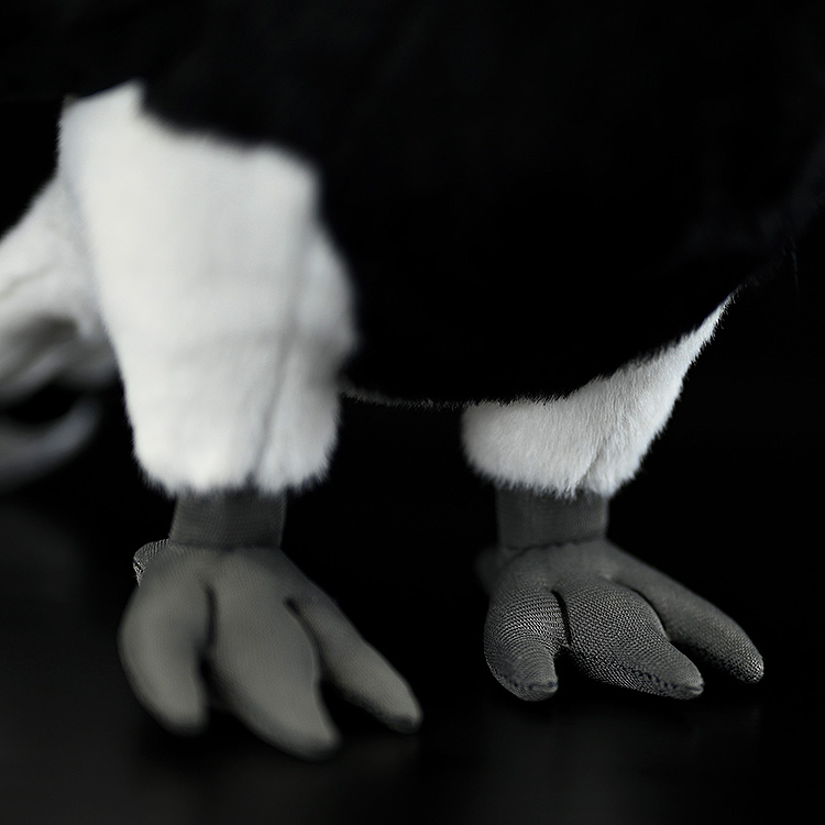 Close-up of the detailed feet of a Rhinoceros Hornbill plush toy, showcasing precise craftsmanship