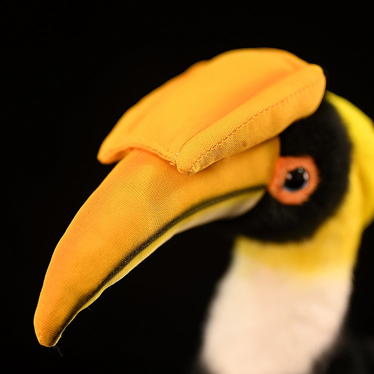 Close-up of lifelike Great Hornbill plush toy's realistic yellow beak, crafted with fine details