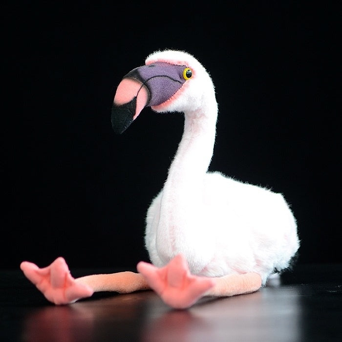 Adorable flamingo stuffed animal in a sitting position, featuring vibrant pink accents and soft material