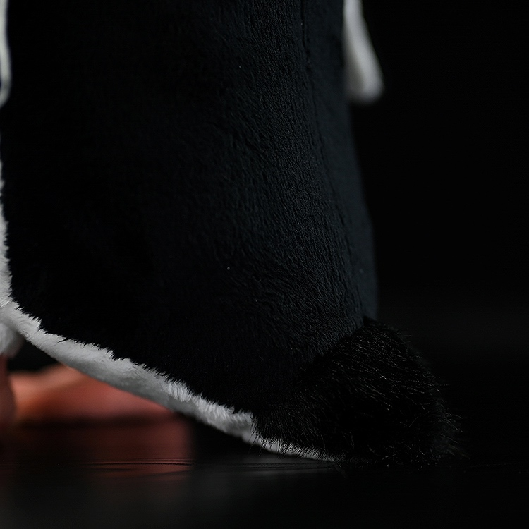 Close-up of the Fiordland penguin plush tail, featuring soft black fabric and realistic stitching details, crafted by SoftDaysLab