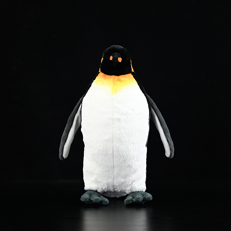 Front view of a king penguin stuffed animal with vibrant orange chest markings and soft fabric design