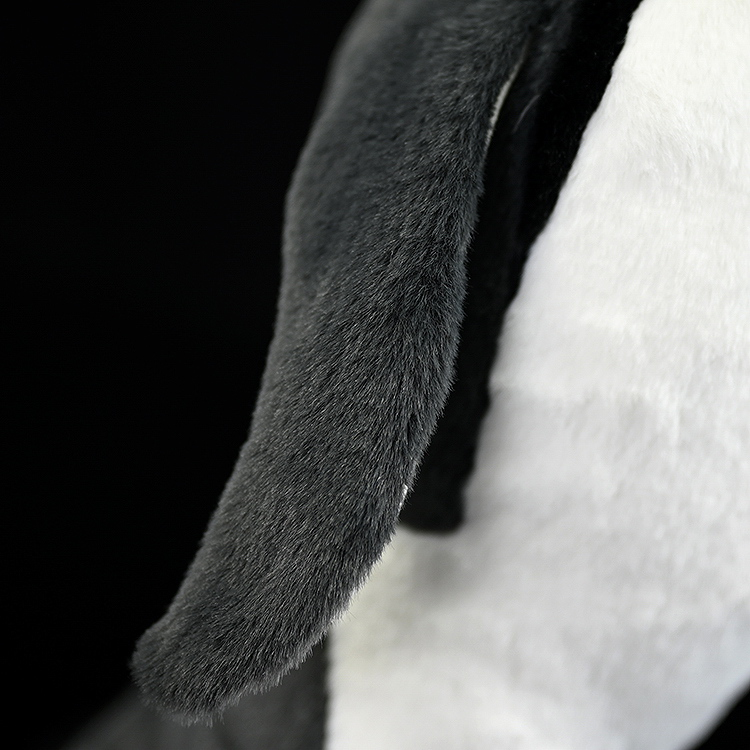 Close-up of king penguin plush wing with soft fabric texture, lifelike design for penguin enthusiasts