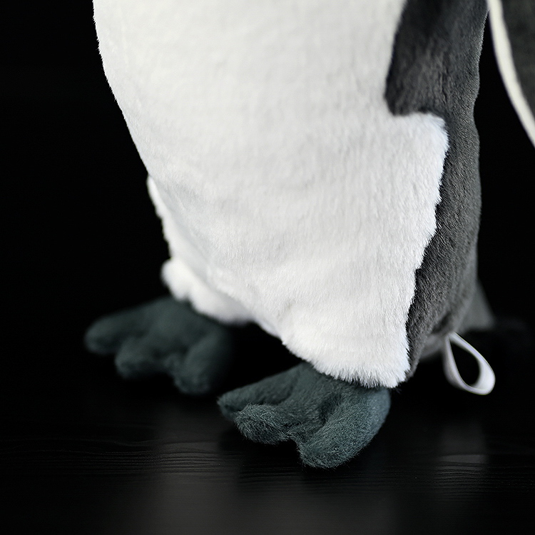 Close-up of king penguin plush feet, showcasing realistic design with soft and durable stitching