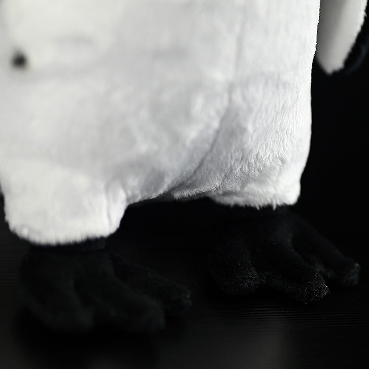 Close-up of African Penguin plush toy’s feet, highlighting soft material and lifelike design