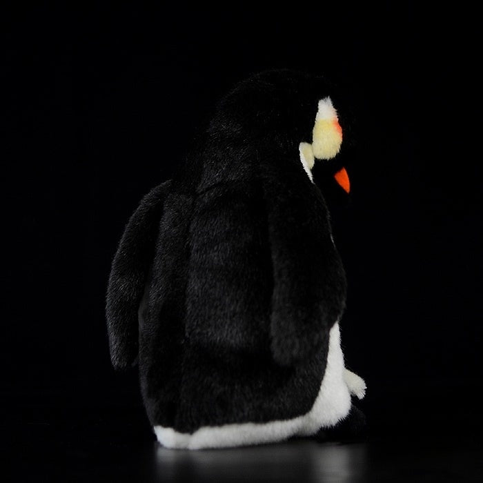 Rear view of Mom & Baby emperor penguin plush, highlighting its sleek black and white design