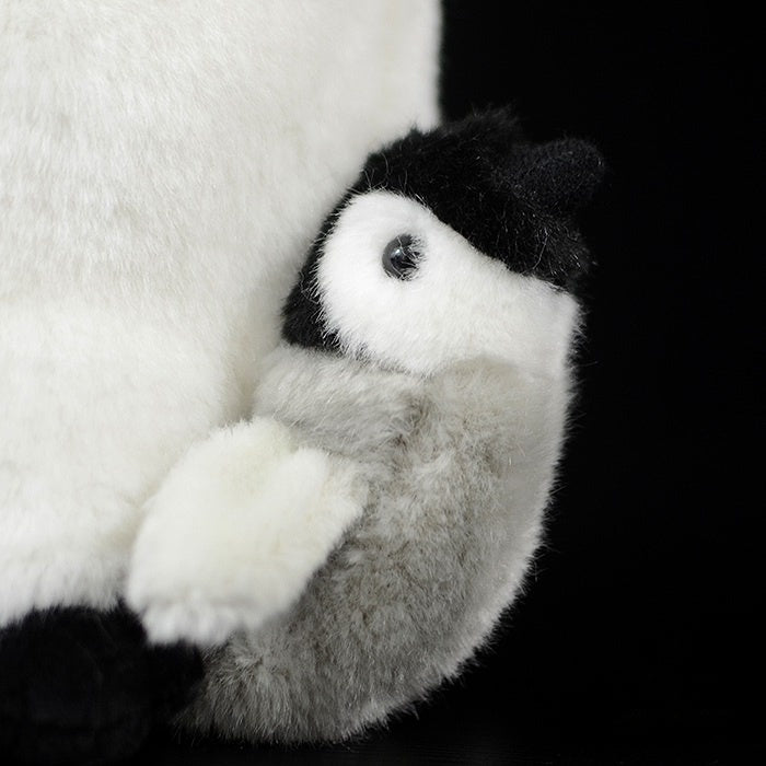 Close-up of baby penguin plush, featuring fluffy silver-grey down and adorable details by SoftDaysLab