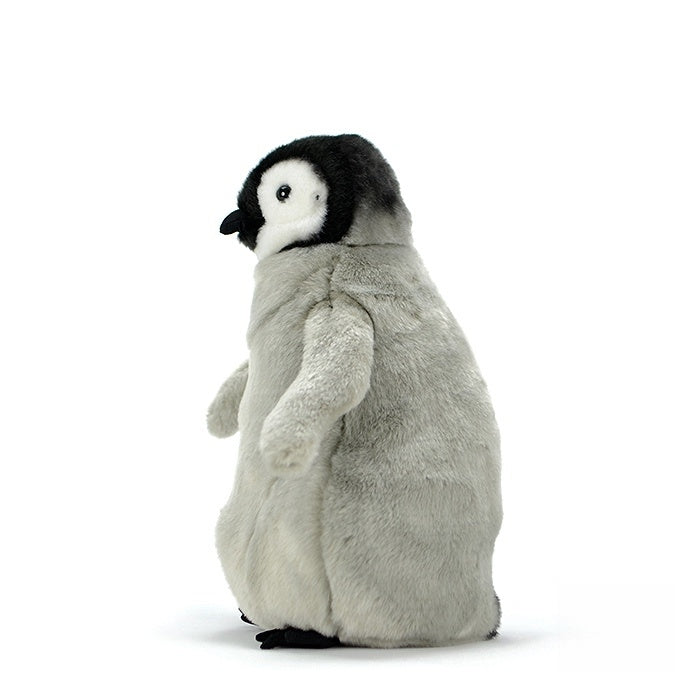 Side view of a lifelike emperor penguin chick plush, showcasing its soft texture and rotatable head