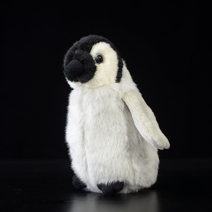 Side view of a baby emperor penguin chick plush by SoftDaysLab, lifelike, soft, and adorable design