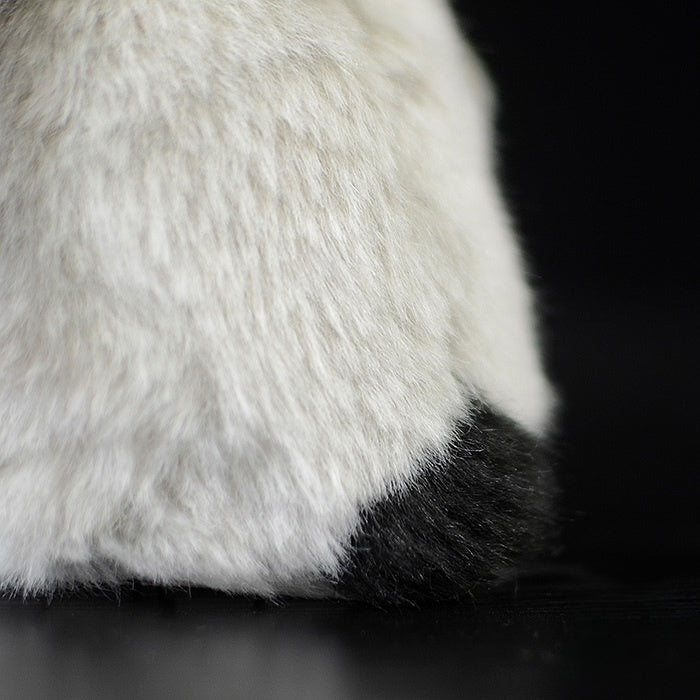 Tail detail of a baby emperor penguin chick plush, featuring soft fur and lifelike design for animal lovers