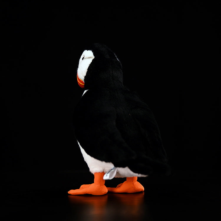 Realistic Atlantic Puffin stuffed animal showing detailed back feathers and vivid orange feet