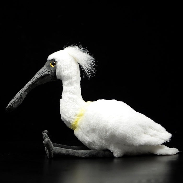 Side view of black-faced spoonbill plush toy by SoftDaysLab, featuring soft white feathers and realistic bill