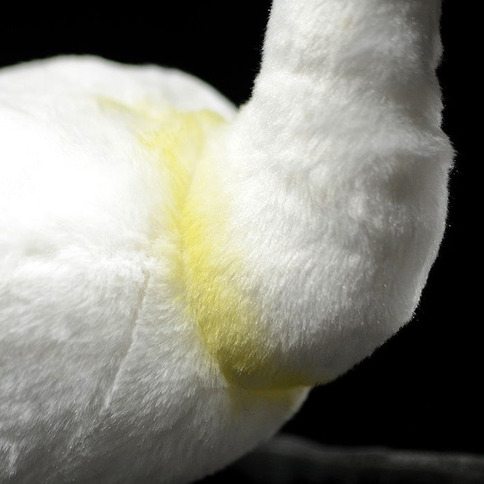 Soft yellow feather detail on black-faced spoonbill plush toy by SoftDaysLab, mimicking real bird plumage