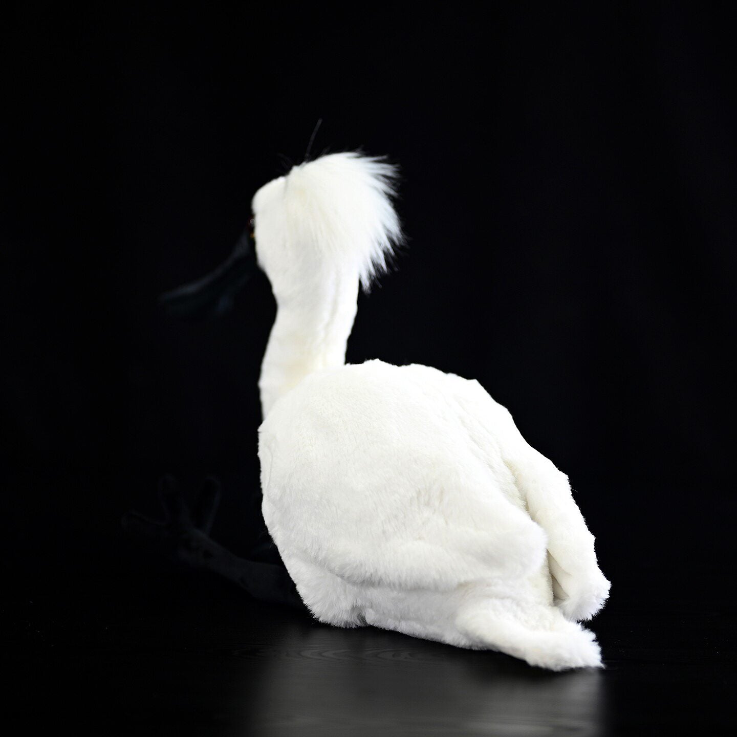 Rear view of the Black-faced Spoonbill Plush Toy showcasing its soft white feathers and plush tail