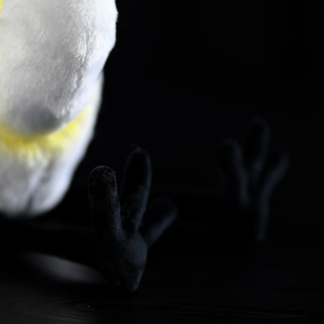 Close-up of the plush feet of the Black-faced Spoonbill Toy, crafted for realism and added charm