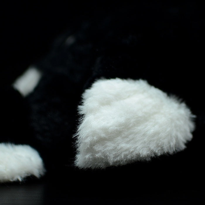 Fluffy white feather detail on ostrich plush toy, mimicking the natural texture of a real ostrich