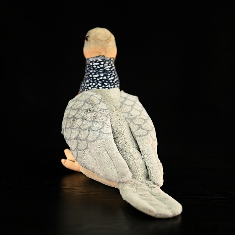 Back view of Spotted Dove plush, highlighting its long tail and realistic textured wings