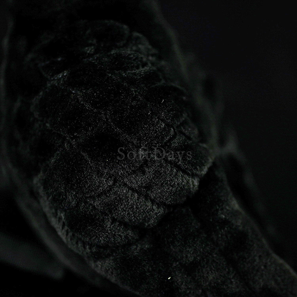 Detailed view of the plush toy’s textured wing, reflecting the realistic design of an American crow