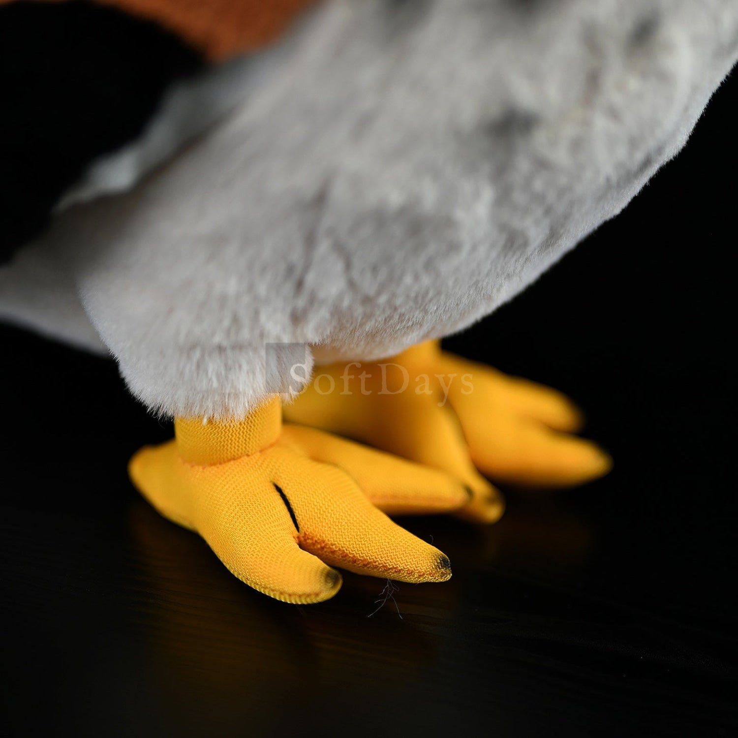 Detailed view of the yellow feet on the Eurasian Kestrel Plush Toy, crafted with realistic precision