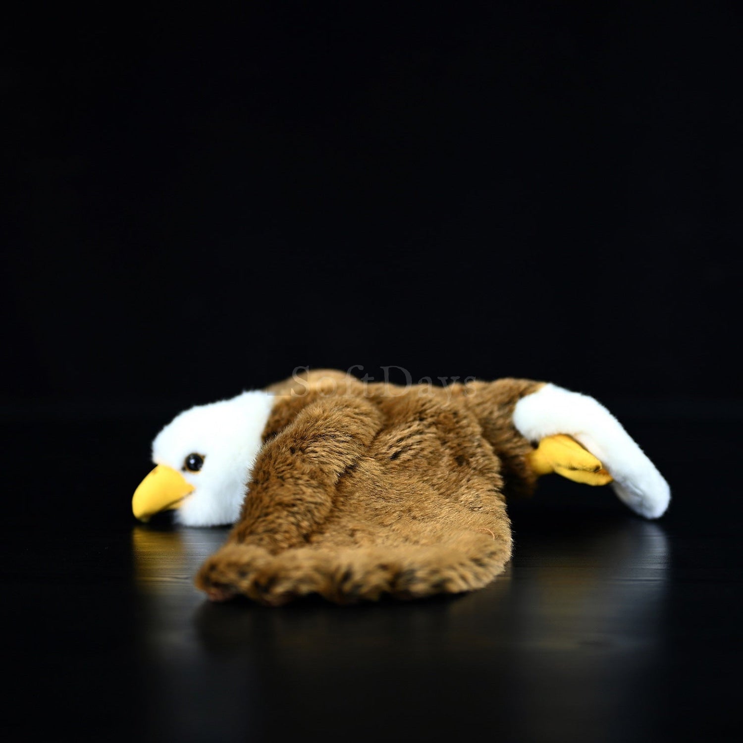 Side view of Soaring Bald Eagle Plush emphasizing detailed brown wings and soft white head