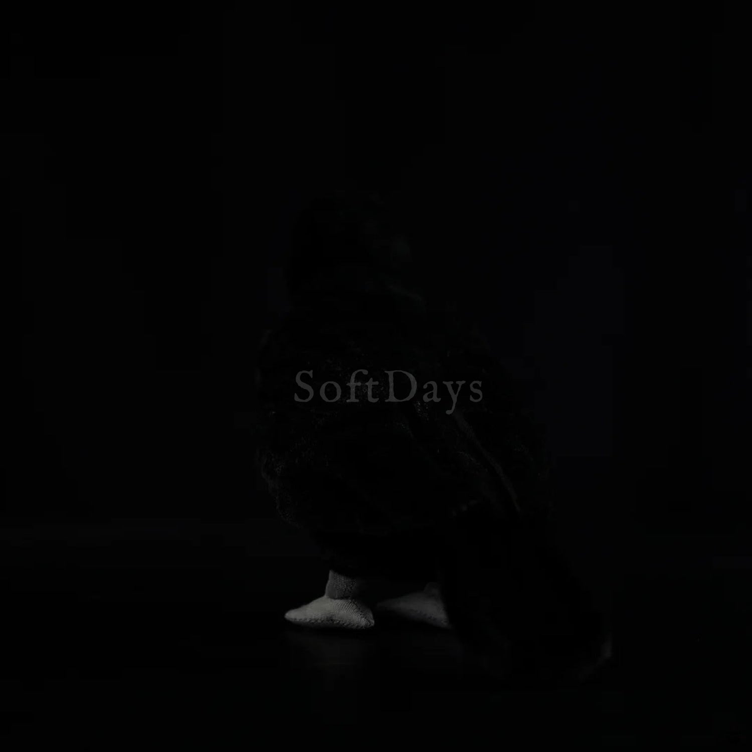 Eurasian Blackbird plush toy with soft black fur, realistic tail design, and detailed stitching