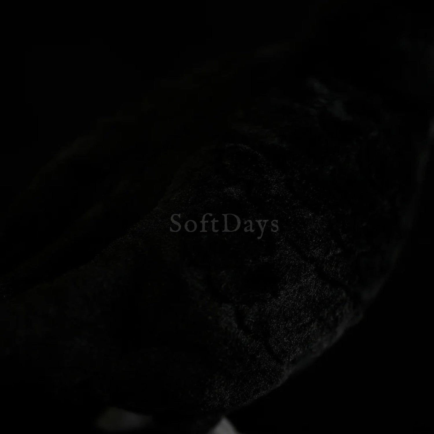 Soft and detailed black fur on the body of the Eurasian Blackbird plush toy