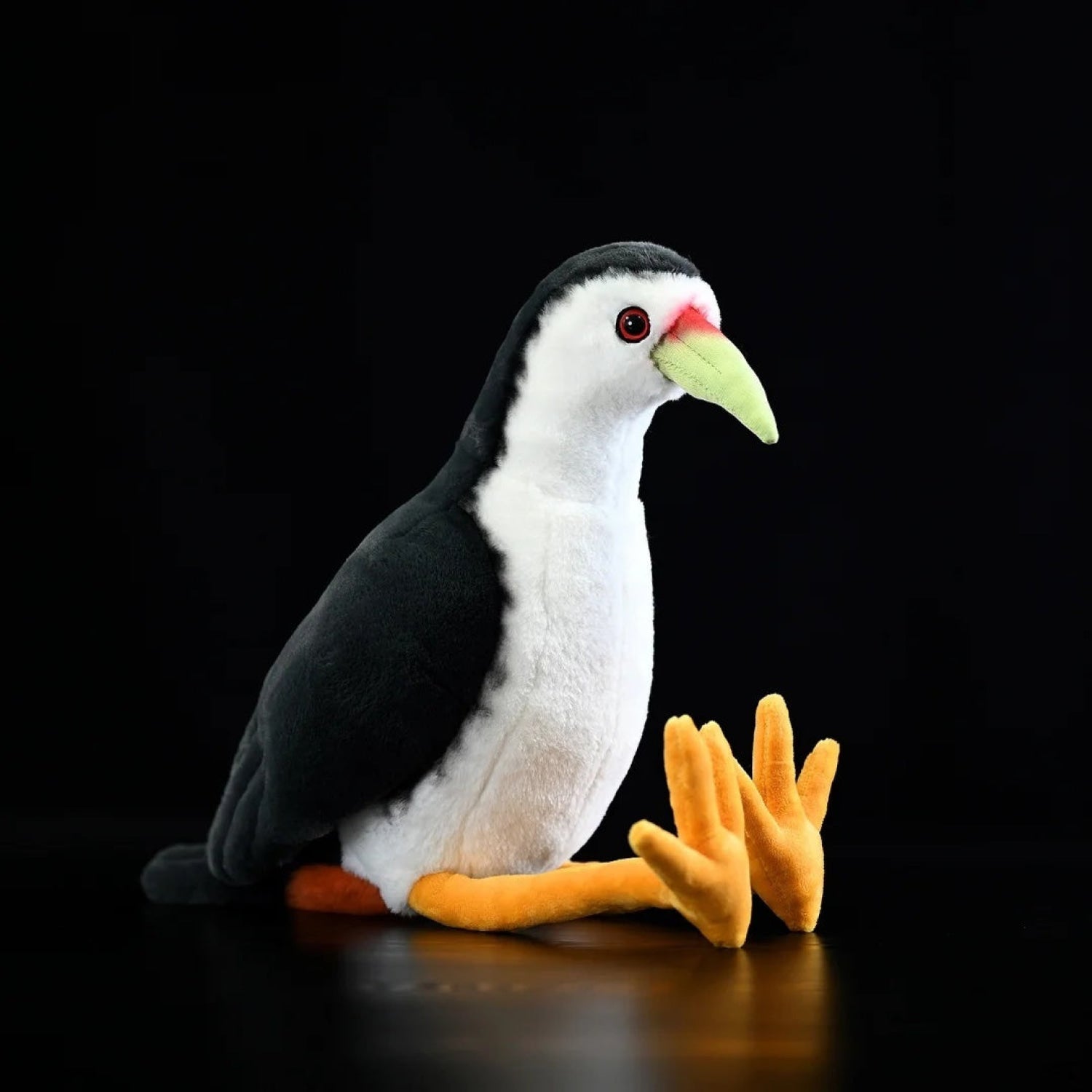 Lifelike White-breasted Waterhen bird plush toy with soft black feathers, a white underside, and orange legs
