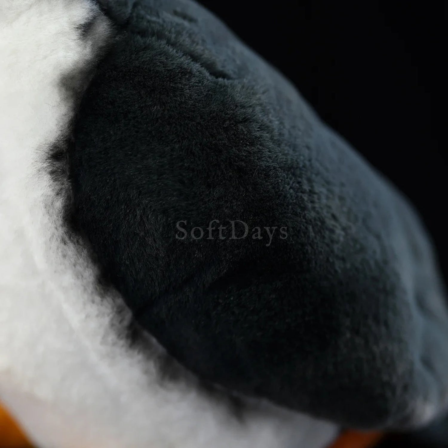 The soft black feathers of the White-breasted Waterhen plush, highlighting its realistic texture