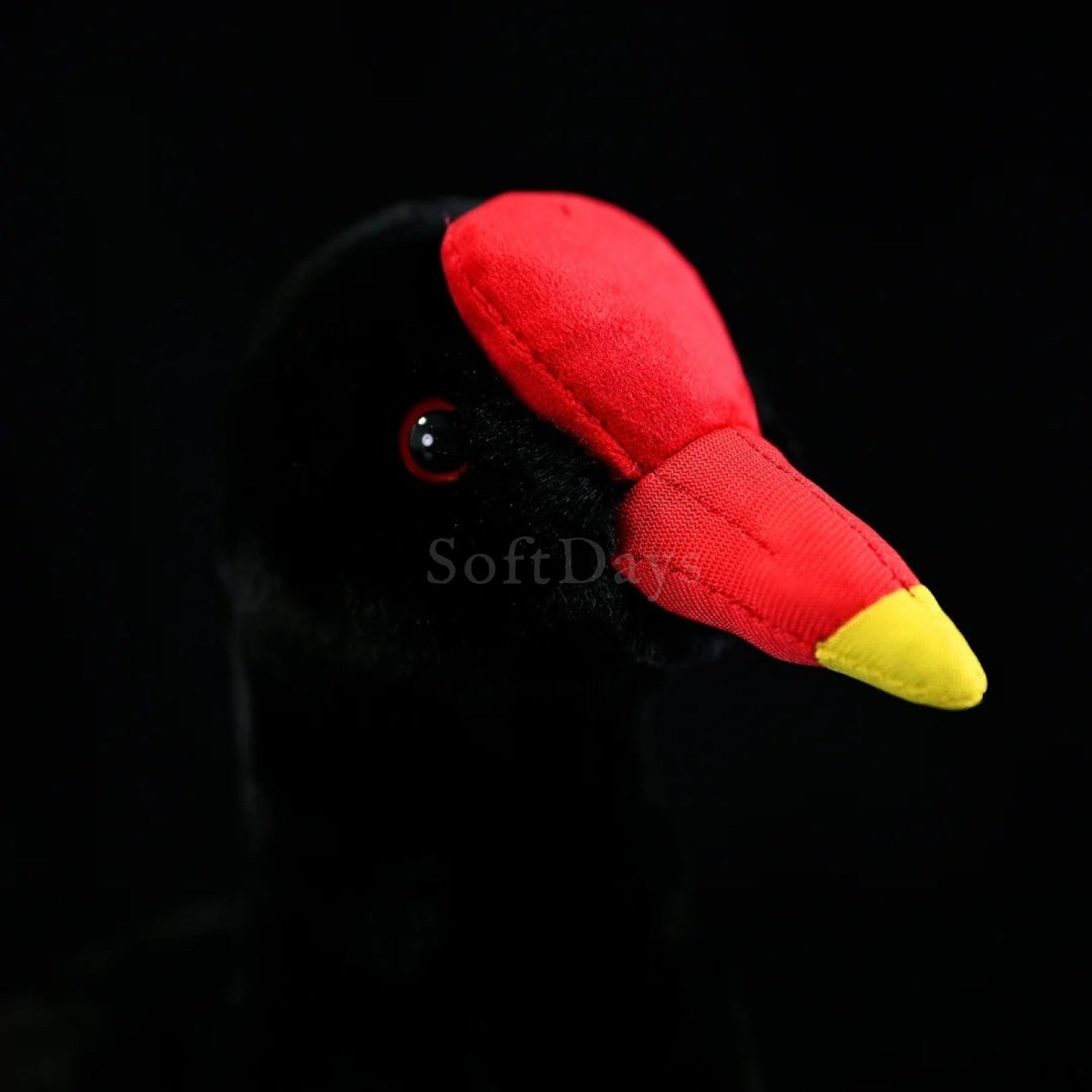 Close-up of a Common Moorhen bird plush's vibrant red beak, yellow legs, and soft materials