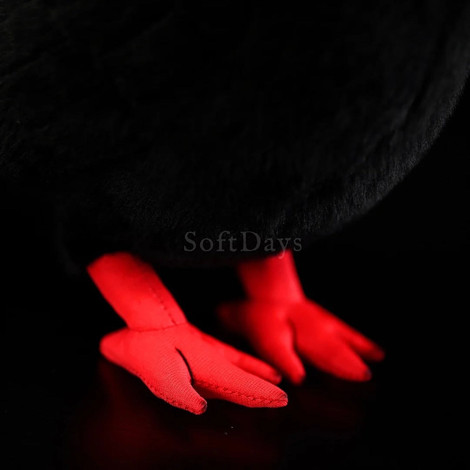 Close-up of Red-Billed Chough bird plush toy's vibrant red feet, showcasing lifelike design and fine details