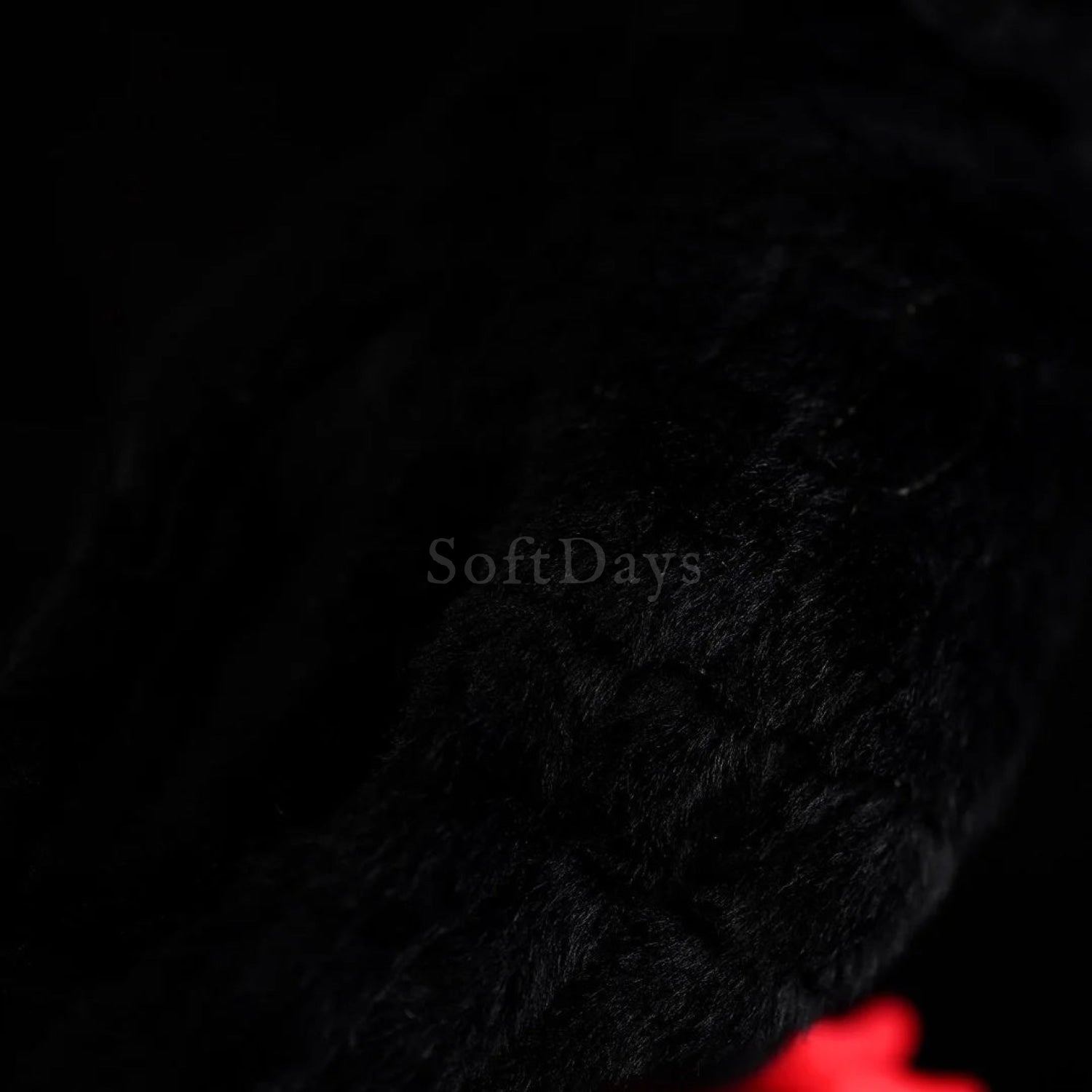 Texture close-up of Red-Billed Chough bird plush toy's soft black feathers, ideal for bird-inspired gifts