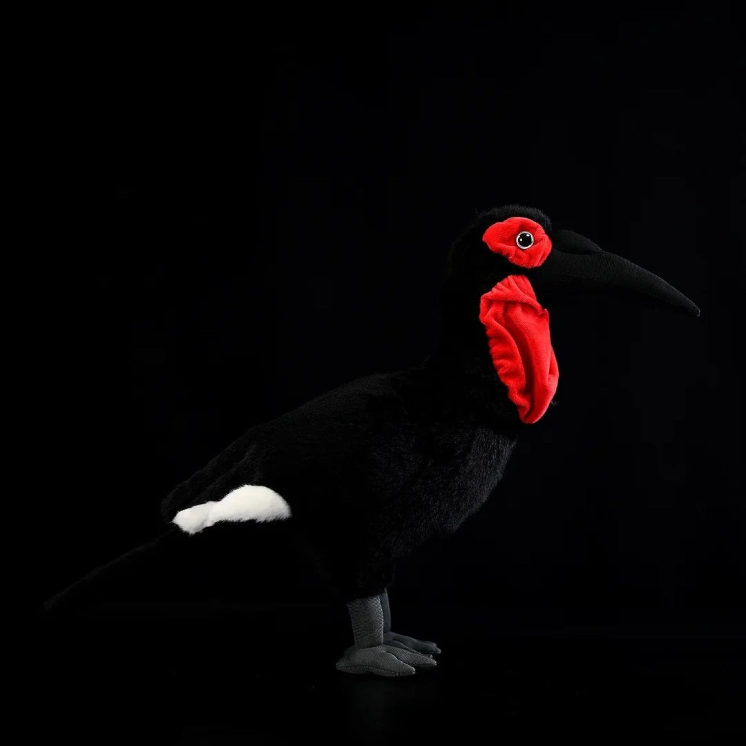 Southern Ground Hornbill bird plush toy with realistic black body, red wattles, and lifelike details