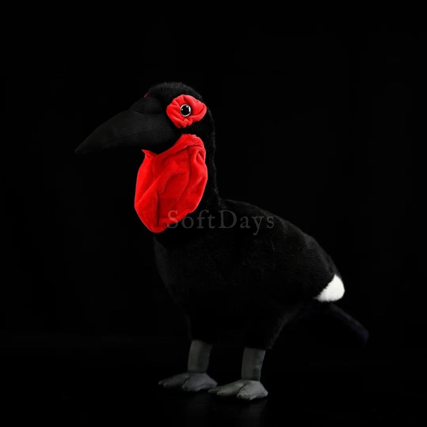 Lifelike Southern Ground Hornbill bird plush toy with red head features and sleek black feathers
