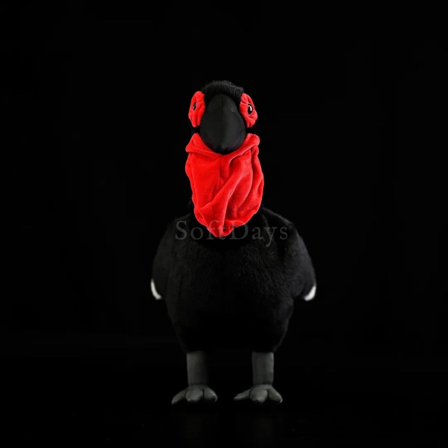 Front view of Southern Ground Hornbill bird plush toy with realistic red wattles and black body