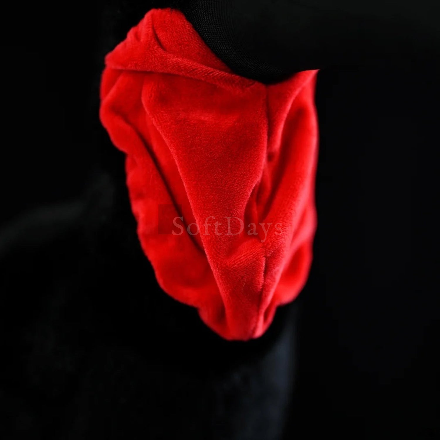 Close-up of Southern Ground Hornbill bird plush toy’s vibrant red wattles with realistic texture and soft fabric