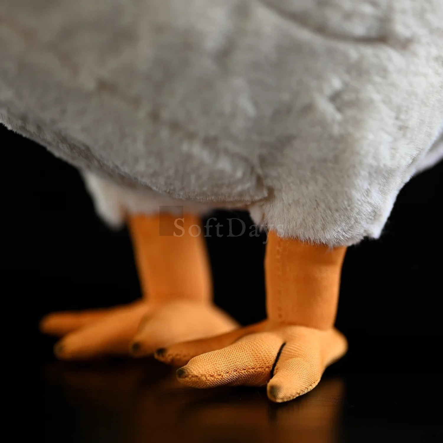 Close-up of hen chicken plush toy’s orange feet with realistic texture, perfect for farm animal-themed decor