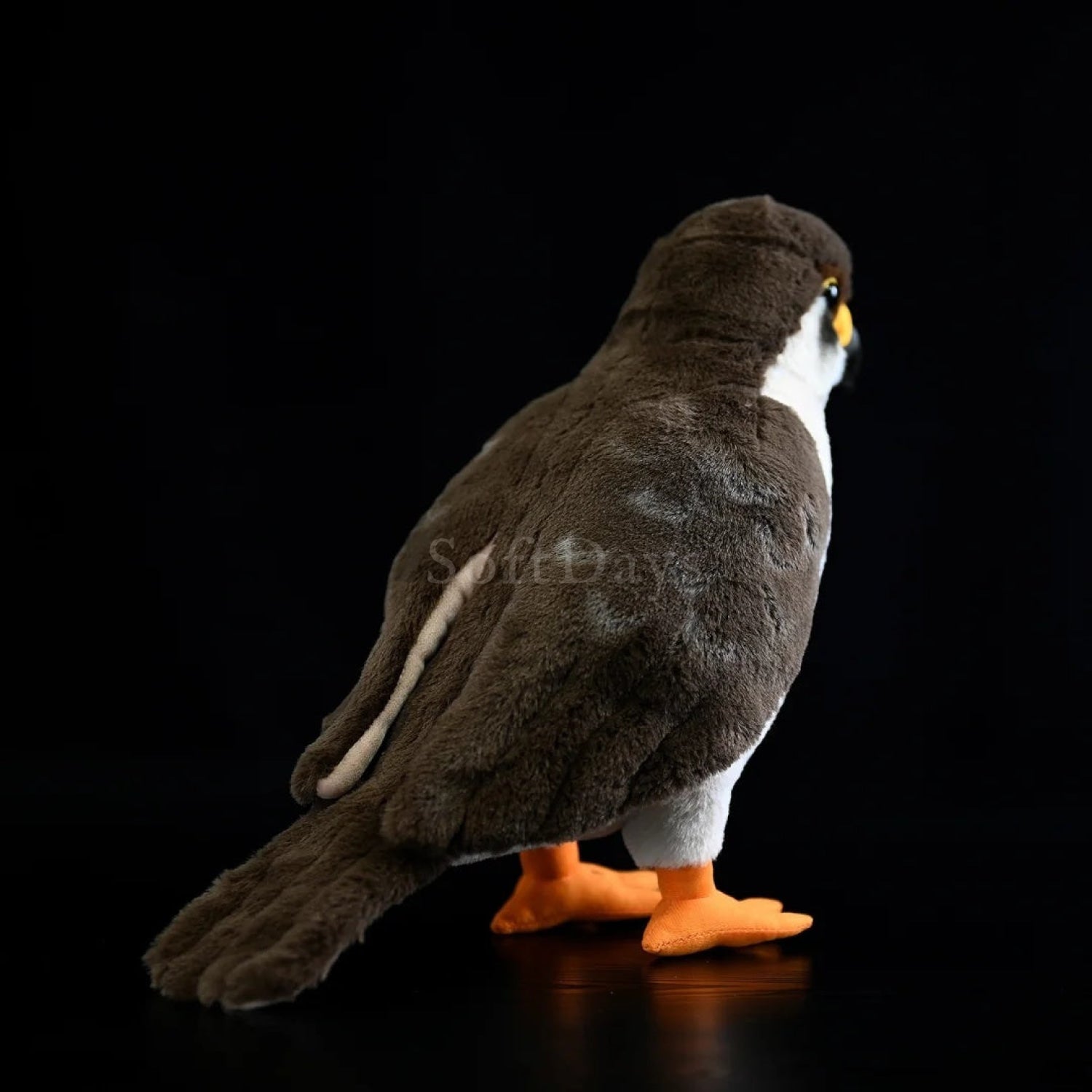 Back view of realistic peregrine falcon plush toy with soft gray feathers and a detailed tail design