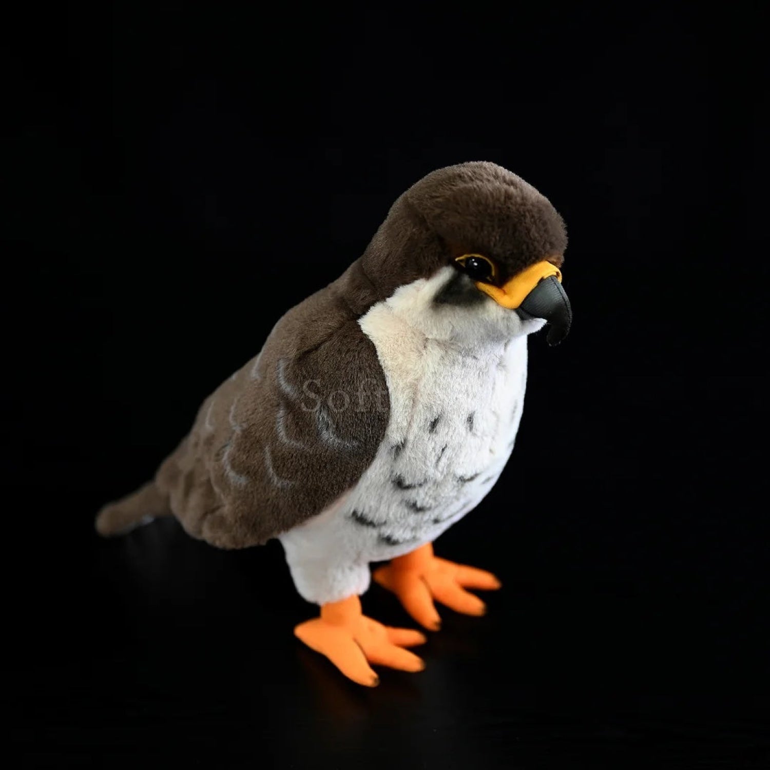 Realistic peregrine falcon plush toy with detailed black beak, lifelike feathers, and bright orange talons