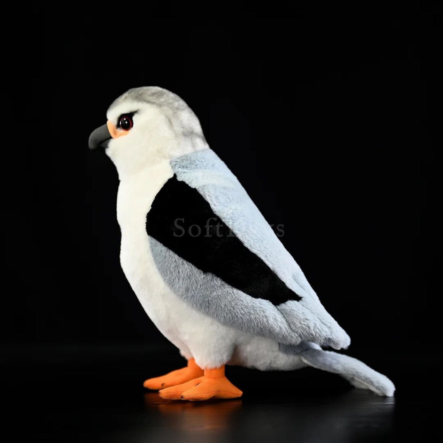 Lifelike black-winged kite plush with detailed grey wings, black patches, and vibrant orange talons