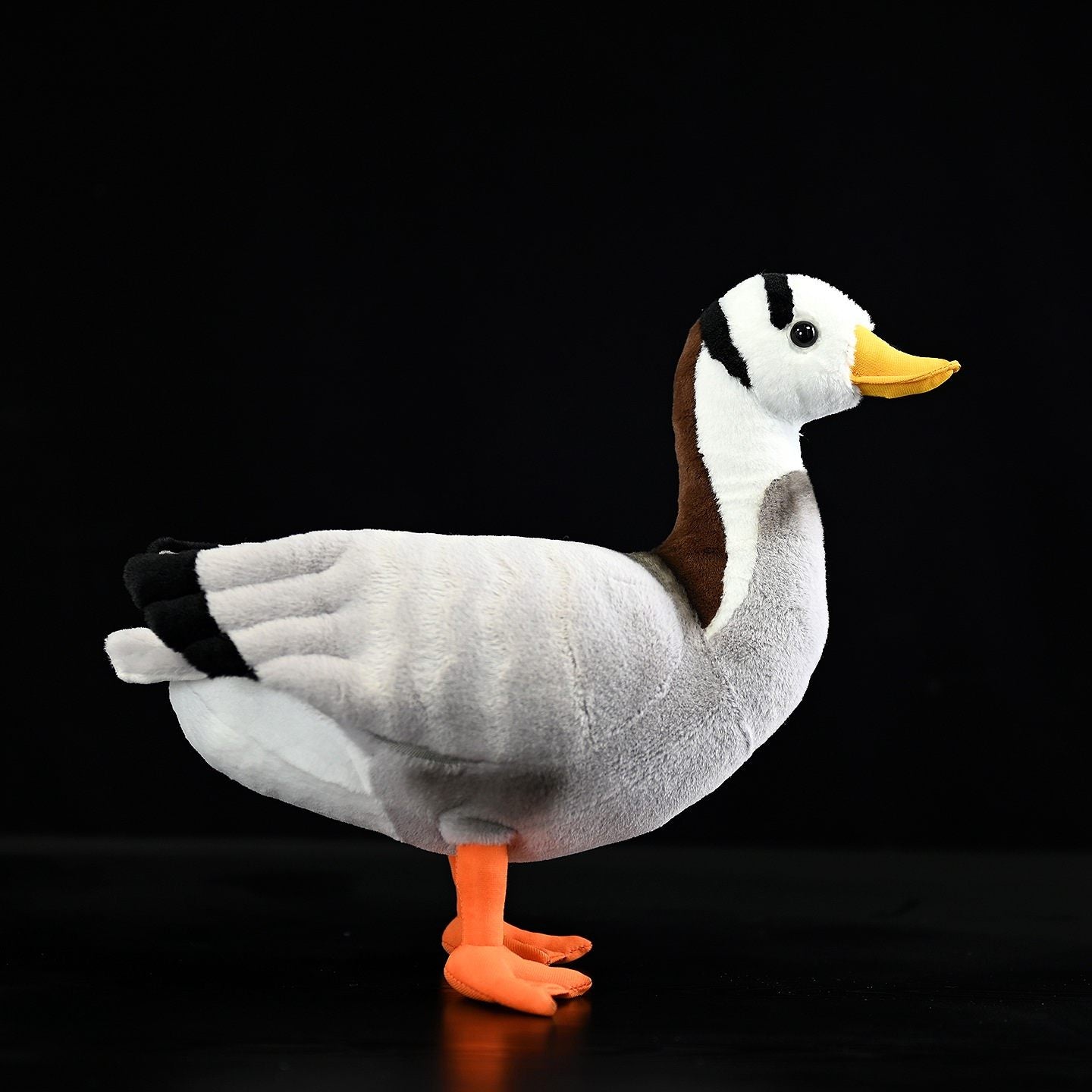 Side view of a lifelike Bar-headed Goose plush toy with realistic details by SoftDaysLab
