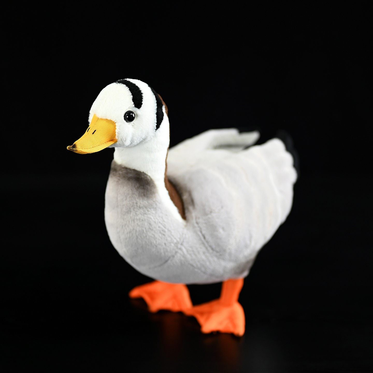 Close-up of a Bar-headed Goose plush toy, highlighting a lifelike design and vibrant yellow beak