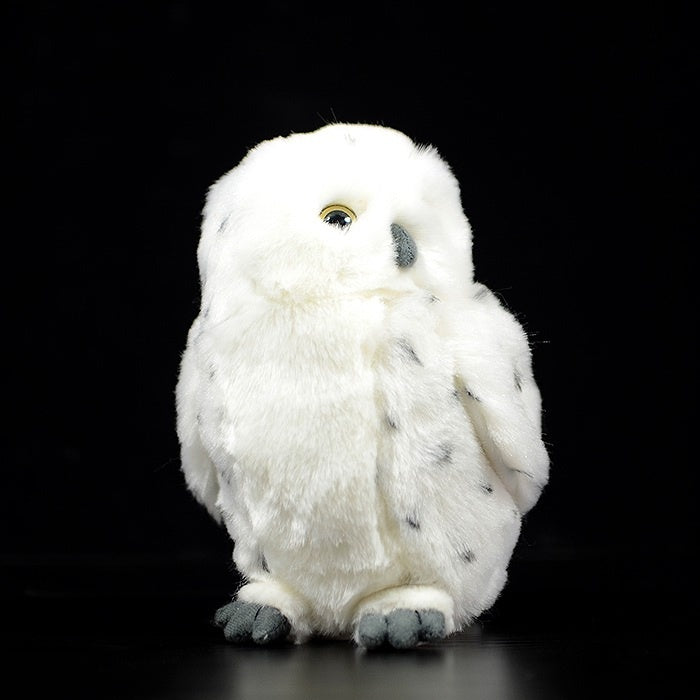 Lifelike snowy owl stuffed animal with detailed design, ideal for home decor or gifting wildlife enthusiasts